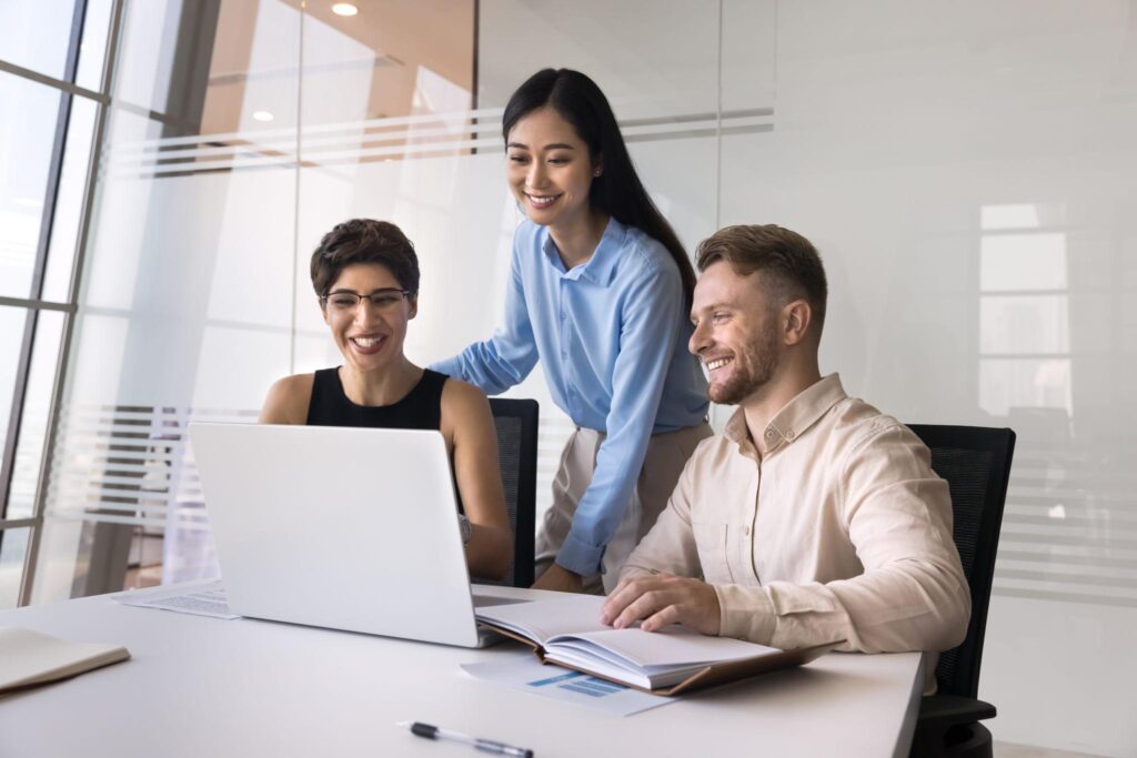 Small business owner using AI automation and productivity tools in a modern office workspace